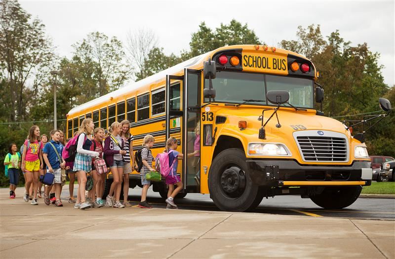 students-loading-the-yellow-school-bus